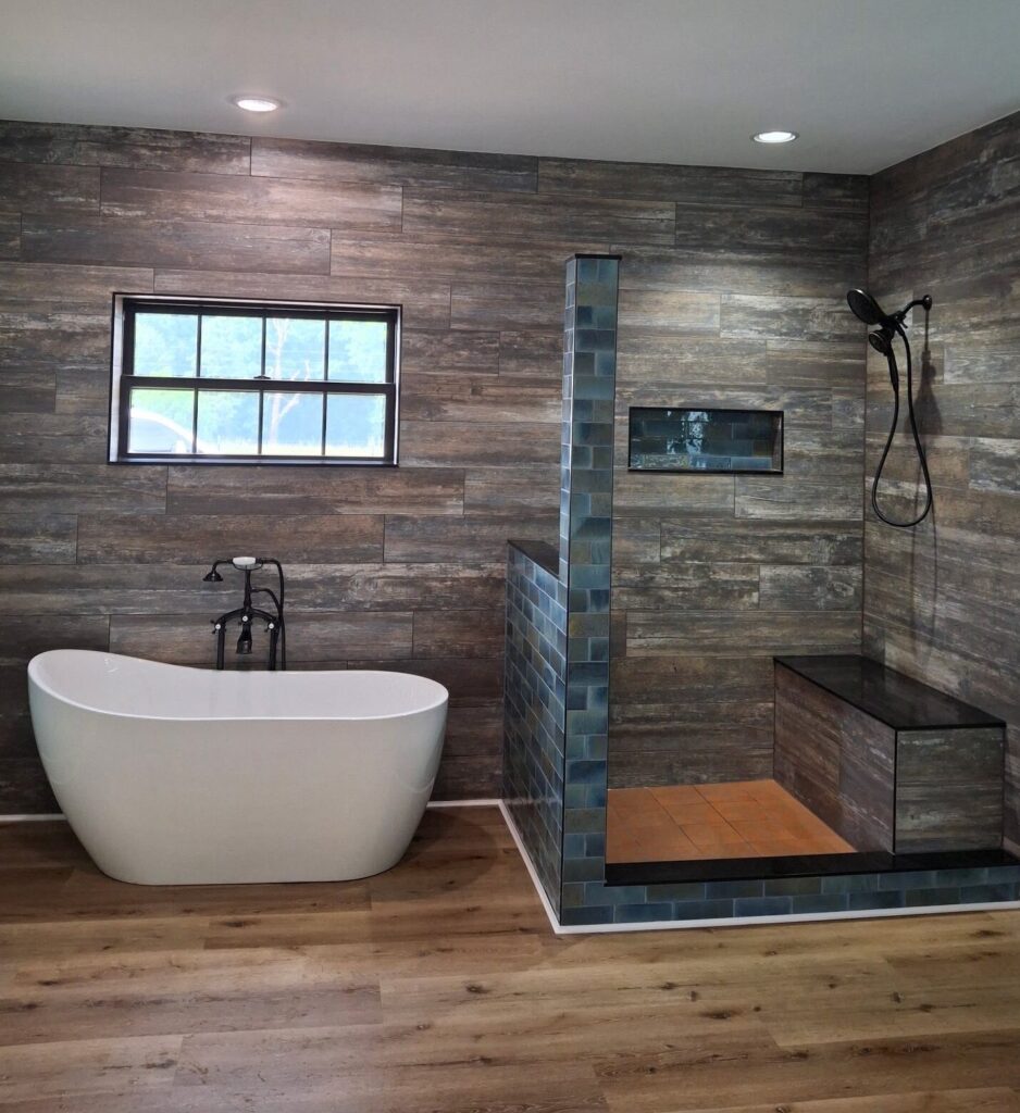 bathroom with walk-in shower and freestanding tub